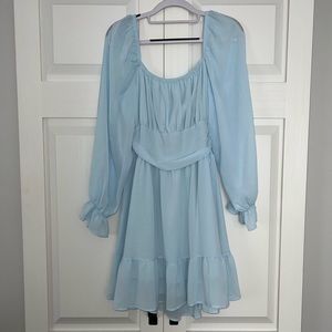 Light blue open back dress.